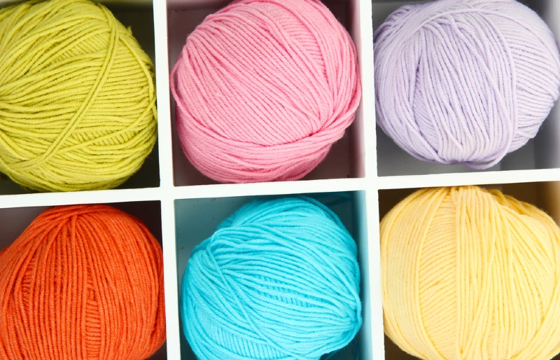 yarn in wooden box with partitions