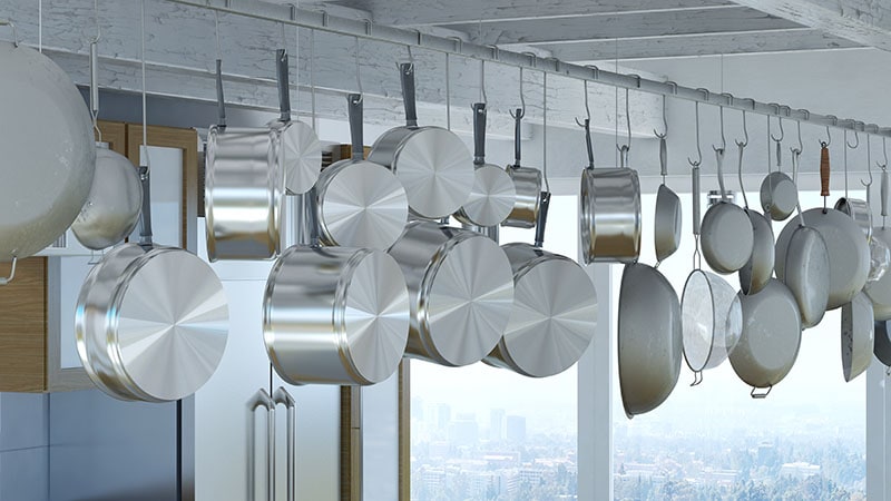 Hanging rack for many pots and pans in a modern kitchen