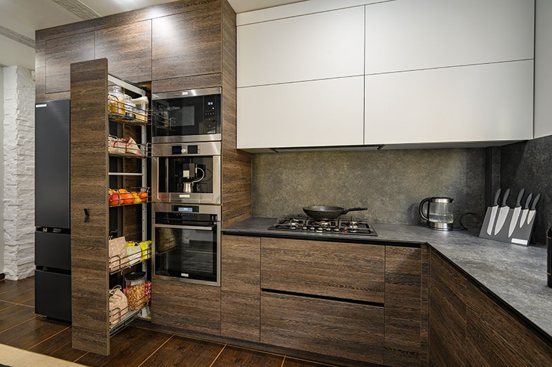 Modern large luxurious dark brown, gray and black cozy kitchen interior