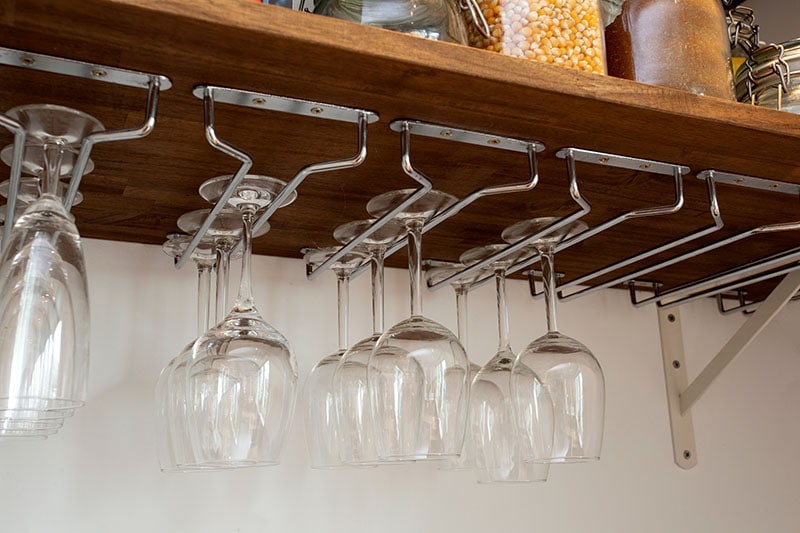 Wine glasses hanging in holder